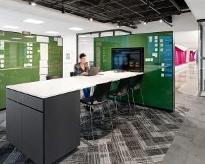 Person working in open concept meeting room at 第一资本金融公司 Headquarters